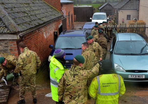 Royal Marines from Bravo Company, 40 Commando helping local communities with flood relief efforts, in Northmoor, Oxford.