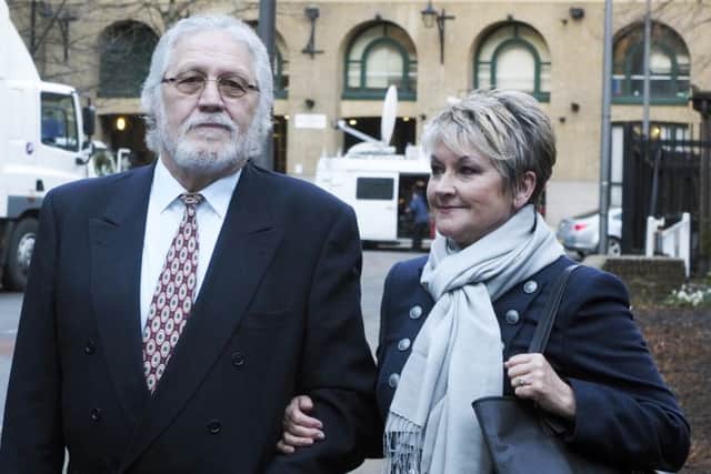 Dave Lee Travis arrives at Southwark Crown Court in London with his wife Marianne