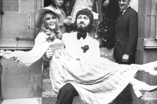 Dave Lee Travis carrying his wife Marianne Bergqvist following their wedding in 1971