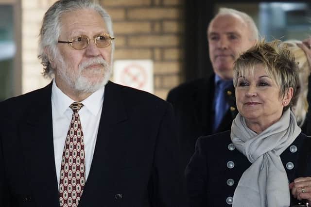 Dave Lee Travis with his wife Marianne as he leaves Southwark Crown Court, London
