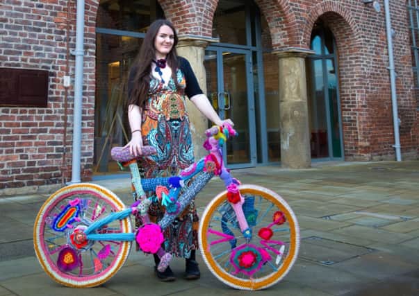Yarn storm artist Cassandra Kilbride pictured with an example of a wool-covered bicycle similar to those that will be exhibited as part of her Woolly Bike Trail project. +picture: Jess Rowbottom/ jrphotos.net