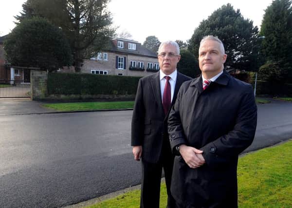 Toby Luper, brother of John, with Detective Chief Inspector Simon Atkinson, outside the house.