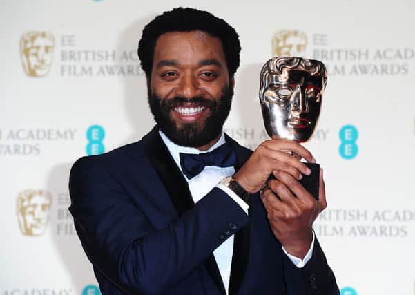 Chiwetel Ejiofor with the Best Actor award for '12 Years A Slave'