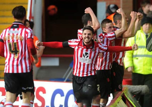 Sheffield United's players celebrate Conor Coady's goal.