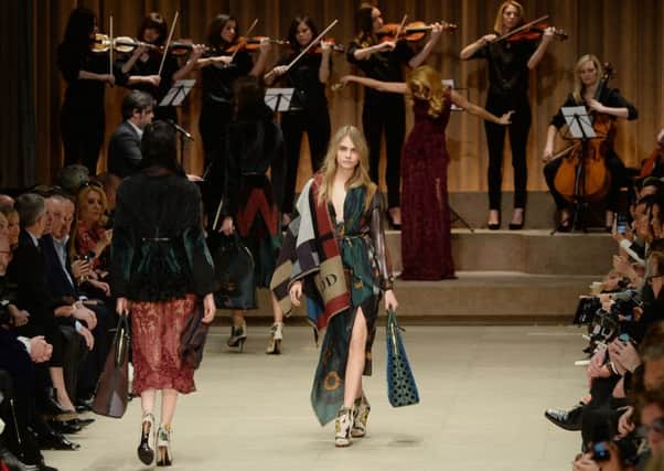 Models on the catwalk during the Burberry Prorsum Autumn/Winter 2014 show in London.