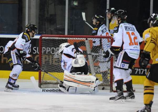 DOWN AND OUT: Nottingham Panthers celebrate their fourth goal at the NIC on Tuesday night. Picture: Dean Woolley.