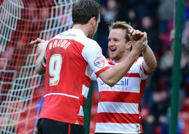 HAPPY: Doncaster Rovers' James Coppinger, right.