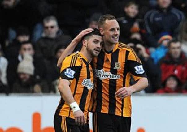 City's Shane Long (left) celebrates scoring for Hull.