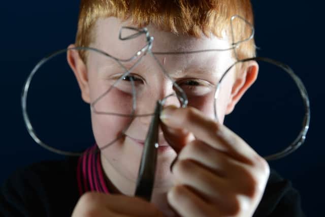 Sam Barraclough, 8, making a wire bike during one of the art sessions at We Love Le Tour de France event at Leeds City Museum.  Picture Bruce Rollinson