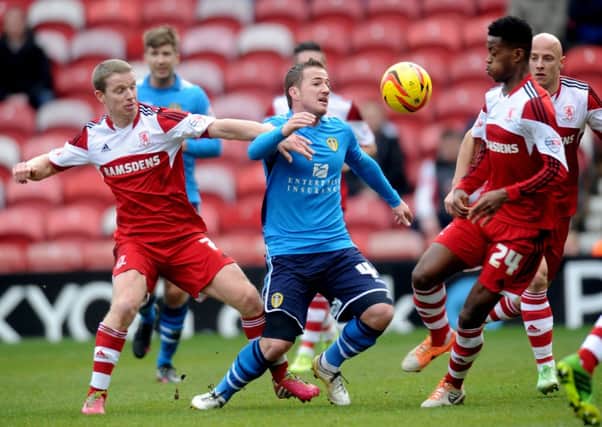 Leeds United's Ross McCormack challenges for the ball alongside Middlesbrough's Grant Leadbitter, (left), and Nathaniel Chalobah, (right).