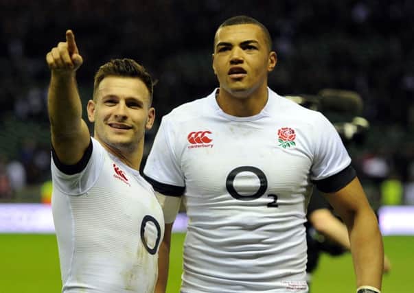 England's Danny Care acknowledges the crowd with team mate Luther Burrell after the RBS 6 Nations match at Twickenham.