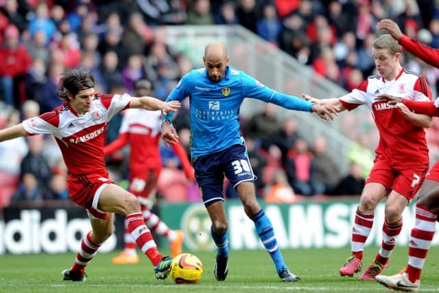 Leeds United's Jimmy Kebe, moves in on Middlesbrough's George Friend.