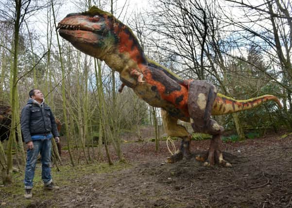 Christian Cristobal with his T-Rex at Dinosaur World, Tong Garden Centre.