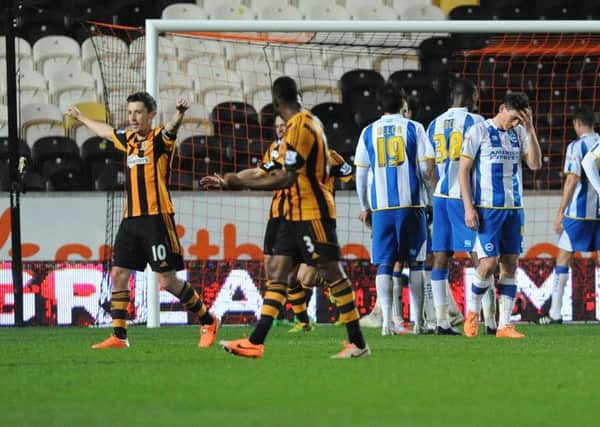Hull City's Robert Koren, left, celebrates after scoring his side's second goal against Brighton.