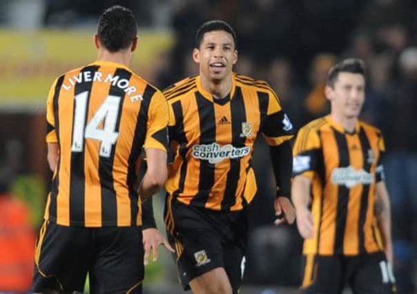 Hull City's Curtis Davies (centre) celebrates with Jake Livemore after scoring his side's first goal during the FA Cup Fifth Round replay at the KC Stadium, Hull.