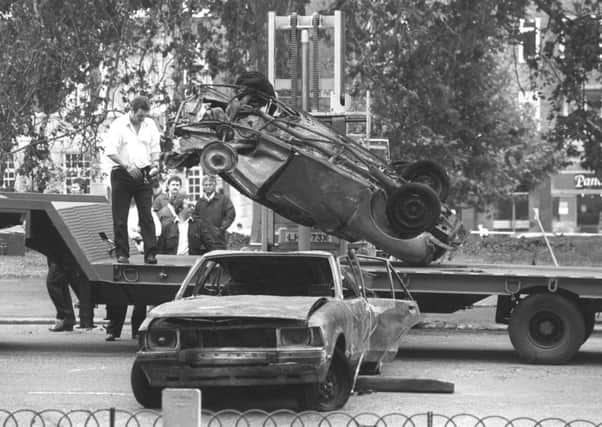Cars removed from the scene of the Hyde Park car bomb in which four soldiers died, 1982