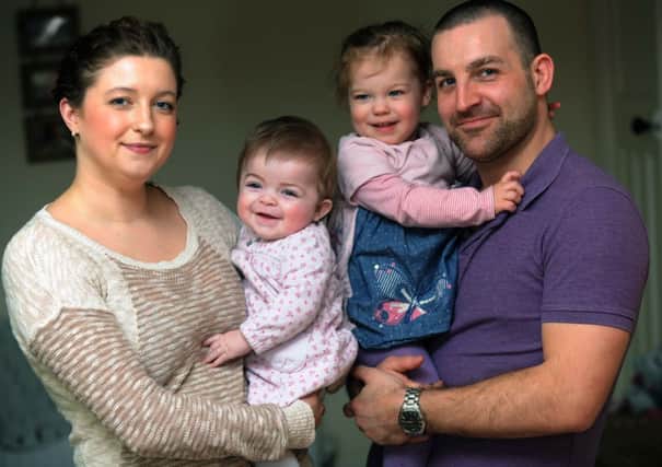 Six-month-old Thea Paterson with parents Richard and Samantha and two-year-old sister Ava
