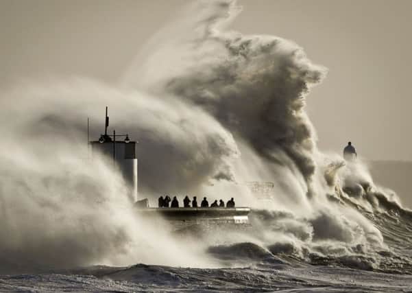 Enormous waves break on Porthcawl harbour, South Wales