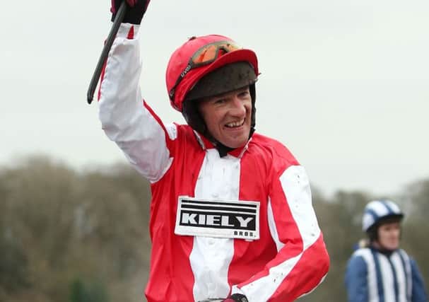 Jockey Paul Carberry celebrates his victory on Monbeg Dude in last year's Coral Welsh National.