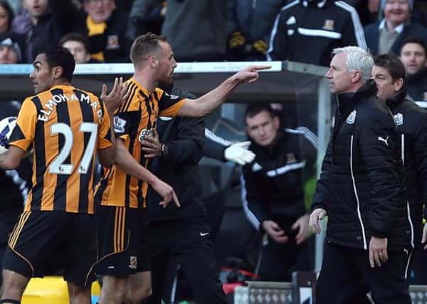 Newcastle United's manager Alan Pardew (right) and Hull City's David Meyler confront each other during the Barclays Premier League match at the KC Stadium, Hull.