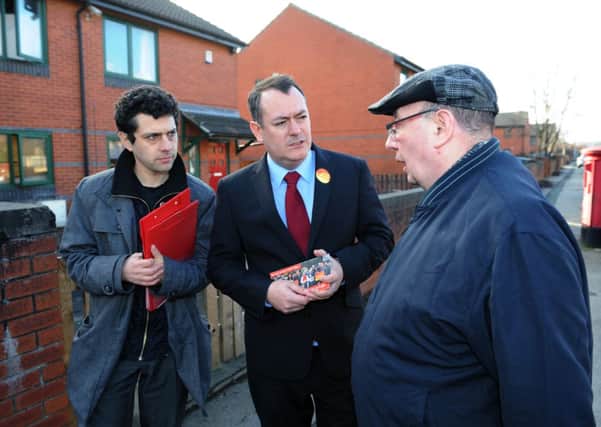 Labour vice chairman and Barnsley MP Michael Dugher (centre) canvassing in Meanwood, Leeds, with local candidate Alex Sobel and resident George Sowrey.
