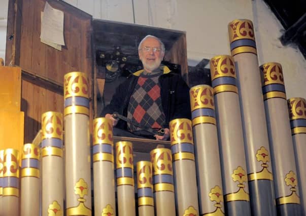 Clock winder Godfrey Allison. Picture: Tony Bartholomew