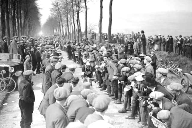 Paris-Roubaix, 1925: 
Spectators line the route as Alfredo Binda breaks from the peloton. 
Photo: Offside / L'Equipe.