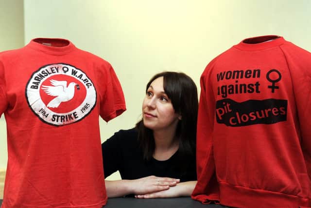 Museum curator Jemma Conway with shirts worn at the time of the 1984-85 miners strike