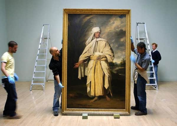 Joshua Reynolds 'Portrait of Omai' being moved before hanging at the Tate Britain, London.