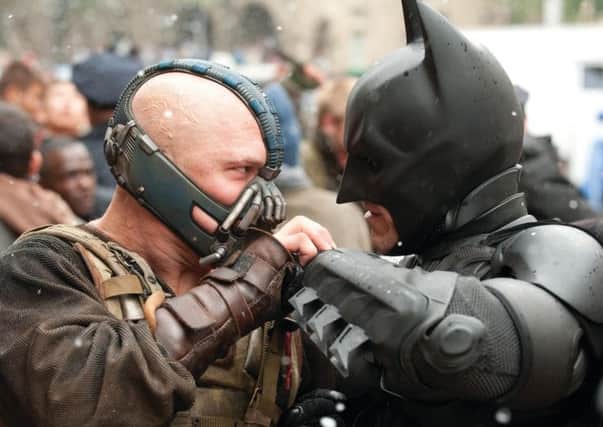 Tom Hardy as Bane and Christian Bale as Batman