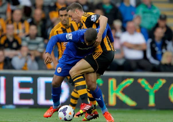 Cardiff City's Fraizer Campbell (front) and Hull City Tigers' James Chester
