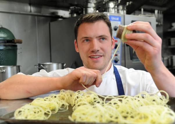 Tommy Banks with a signature dish at The Black Swan at Oldstead near Thirsk
