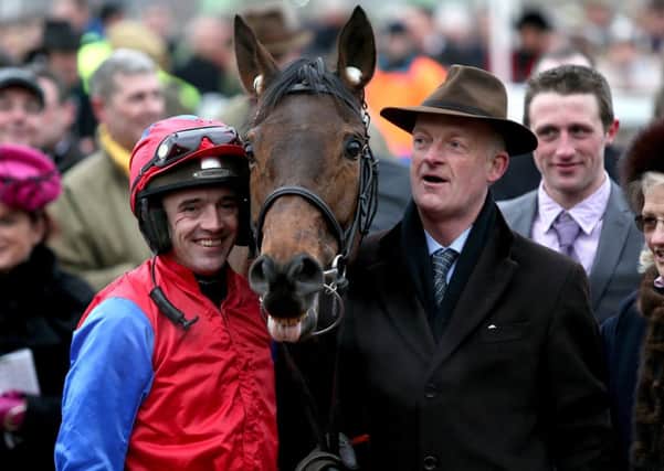 Jockey Ruby Walsh (left) and trainer Willie Mullins with Quevega after victory in the OLBG Mares' Hurdle in 2013.