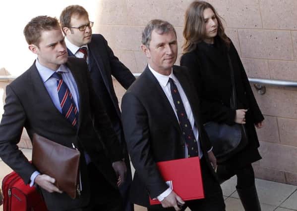 Nigel Evans, former deputy speaker of the House of Commons (right) arrives at Preston Crown Court where he faces nine charges, dating from 2002 to April 1, last year of sexual offences against seven men.