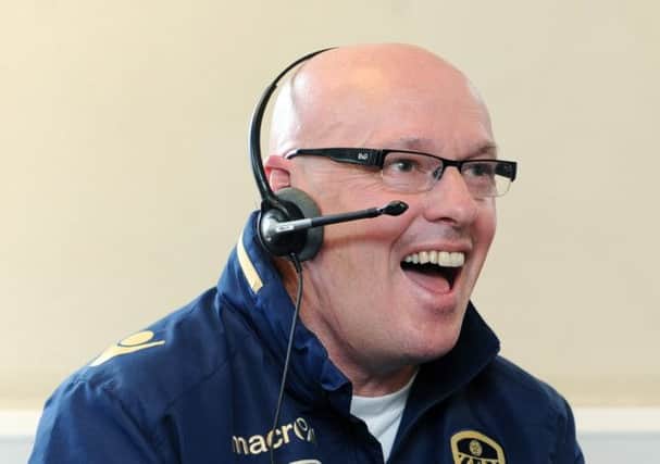 Dial M for murdered: Brian McDermott helped man the ticket phone lines ahead of the 5-1 mauling by Bolton (Picture Jonathan Gawthorpe).