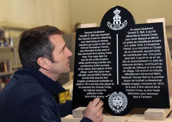 Neil Collinson of  Dales of Thirsk finishing off the memorial to  Donald Bell, the only professional footballer to  have been awarded the Victoria Cross in World War One