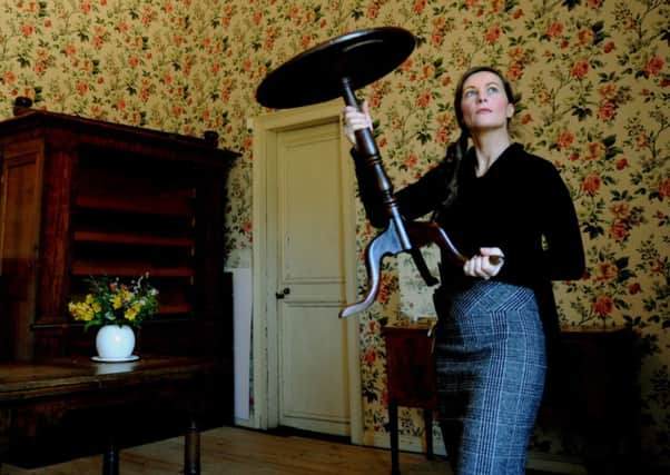 Mollie Dodd, General Manager at Nunnington Hall near Helmsley, clearing out furniture from the West bedroom