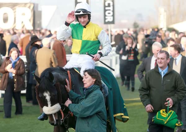 Brian Hughes celebrates on Hawk High after their victory in the Fred Winter Juvenile Handicap Hurdle during Ladies Day at Cheltenham Racecourse, Cheltenham. Picture: David Davies/PA Wire
