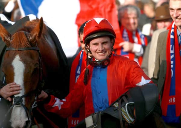Jockey Jamie Moore celebrates with Sire de Grugy after victory in the BetVictor Queen Mother Champion chase during Ladies Day at Cheltenham Racecourse, Cheltenham. (Picture: David Davies/PA Wire)