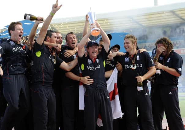 England captain Paul Collingwood (centre) lifts their trophy as they celebrate winning the ICC World Twenty20 Final match at the Kensington Oval, Bridgetown, Barbados.