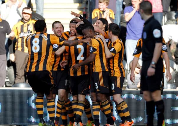 Hull City's Curtis Davies (centre) celebrates with team mates after scoring their first goal during the FA Cup Sixth Round match at the KC Stadium, Hull.