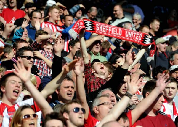 Sheffield United fan sings as the players walk out on the pitch. They will get a ticket allocation of more than 31,000 for the semi-final with Hull City.