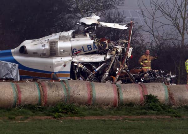 The wreckage of a helicopter alongside the A146