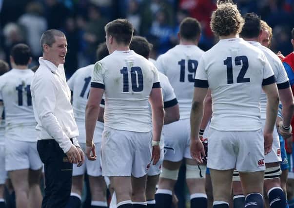 England coach Stuart Lancaster (left) congratulates England players including Owen Farrell (centre) as they leave the pitch following the Six Nations match at the Stadio Olympico, Rome, Italy. Picture: Jonathan Brady/PA Wire.
