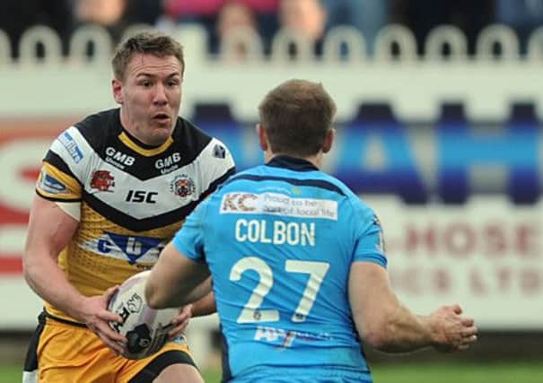 Castleford's Michael Shenton looks for a way past Hull FC's Liam Colbon