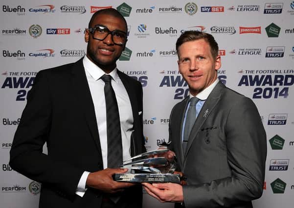 Sheffield Wednesday's Reda Johnson (left) recieves his PFA Player in the Community award from PFA Chairman Richie Humphreys at the Football League Awards 2014