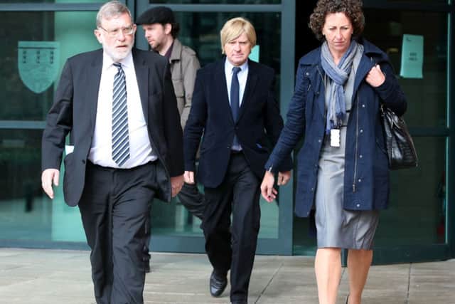 Sir John Randall MP and Michael Fabricant (centre) leave Preston Crown Court