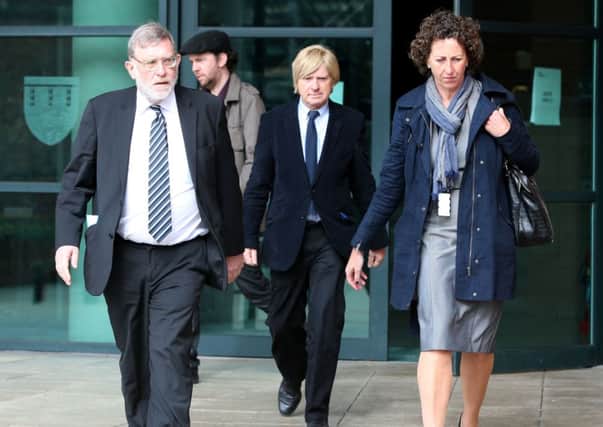 Sir John Randall MP and Michael Fabricant (centre) leave Preston Crown Court