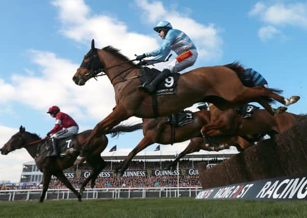 Western Warhorse ridden by Tom Scudamore (front) on their way to winning the Racing Post Arkle Challenge Trophy Chase.