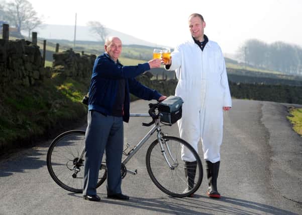 Cyclist Brian Robinson raises a glass of Stage Winner, a pale ale by head brewer Wim van der Spek